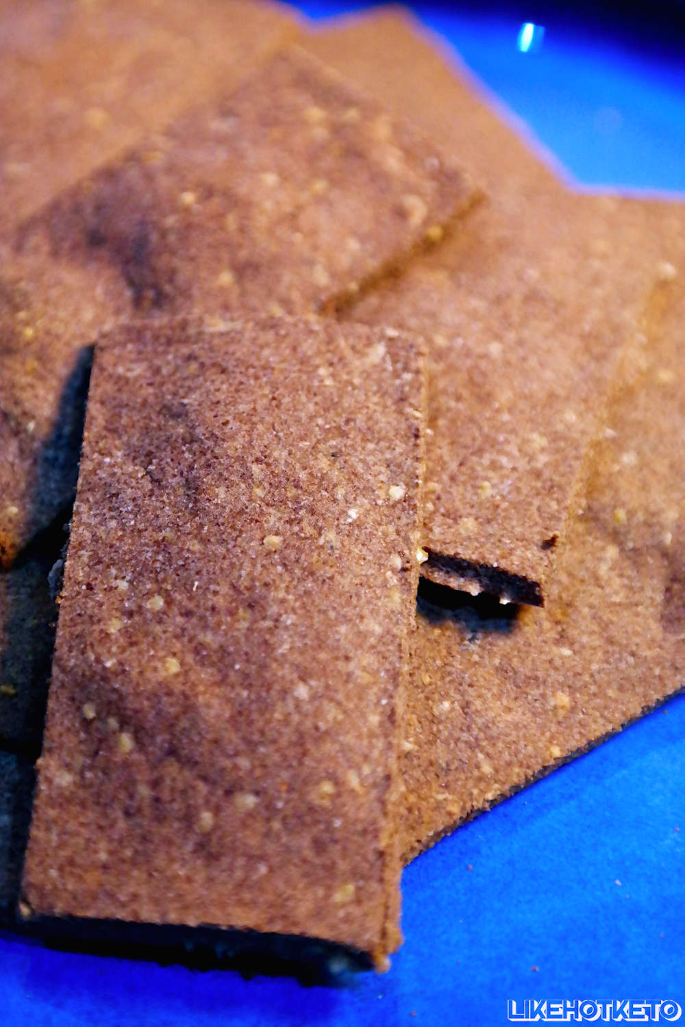 Thin and crispy keto flax meal cheesy crackers.