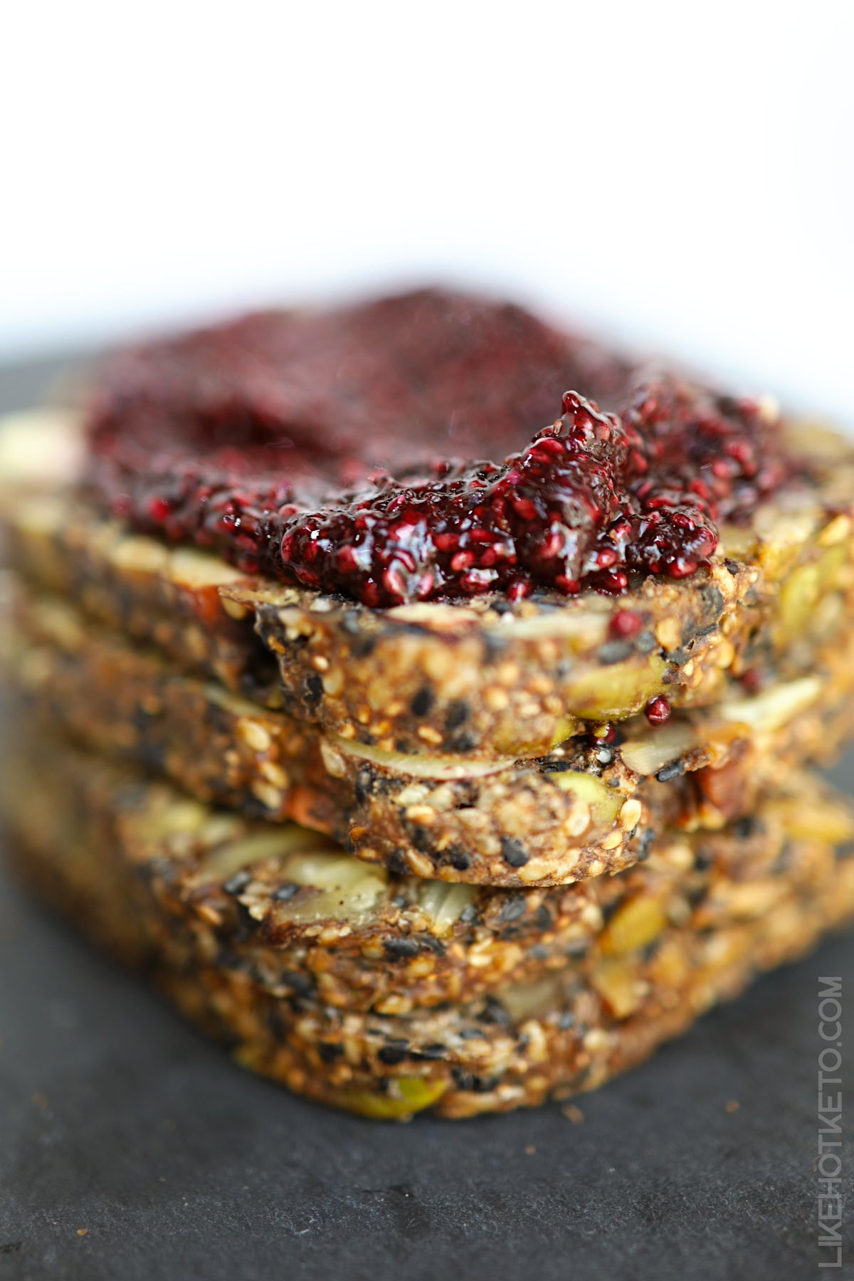 A pile of Viking bread slices topped with keto chia raspberry jam.