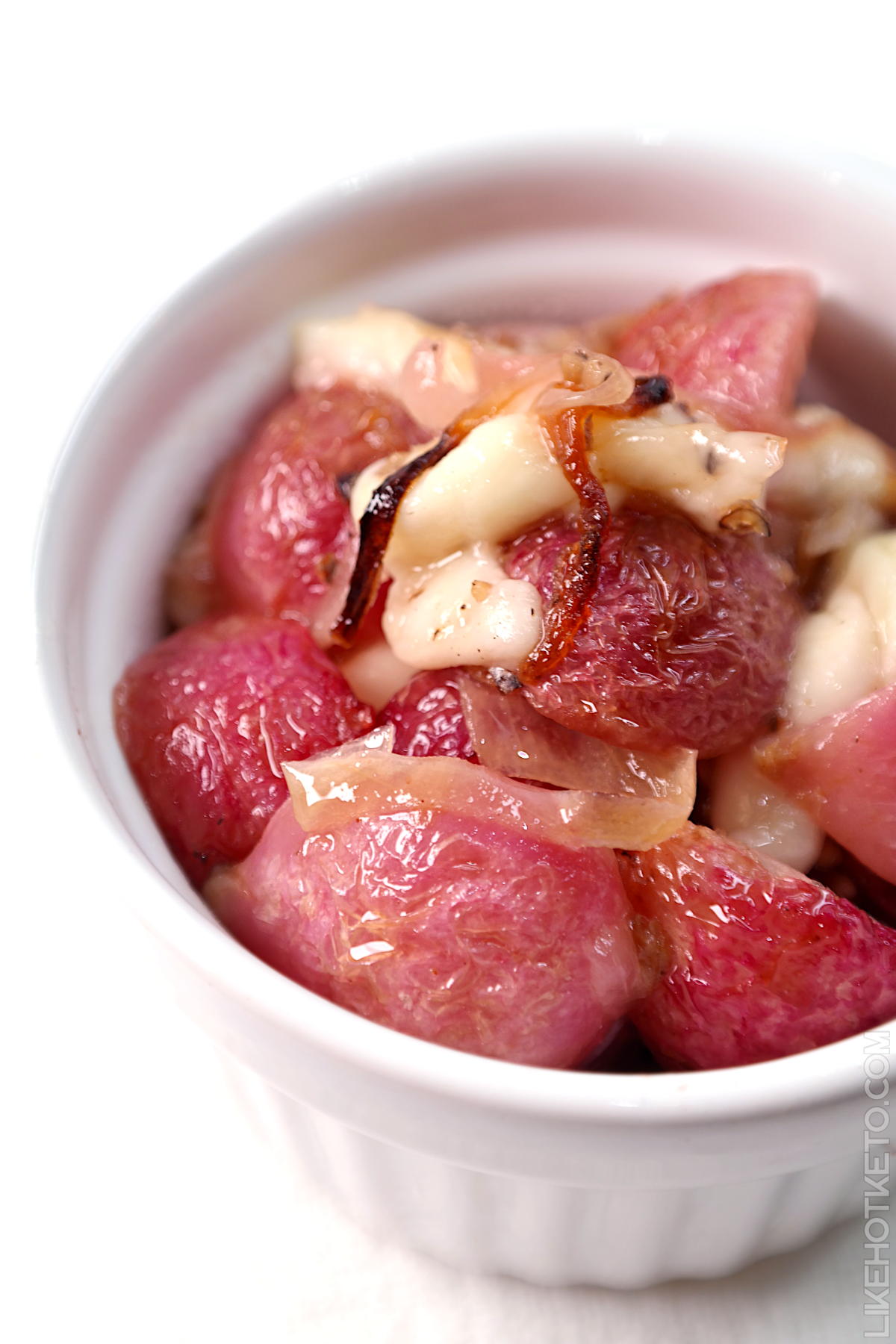 Low-carb loaded roasted radishes in rendered duck fat.