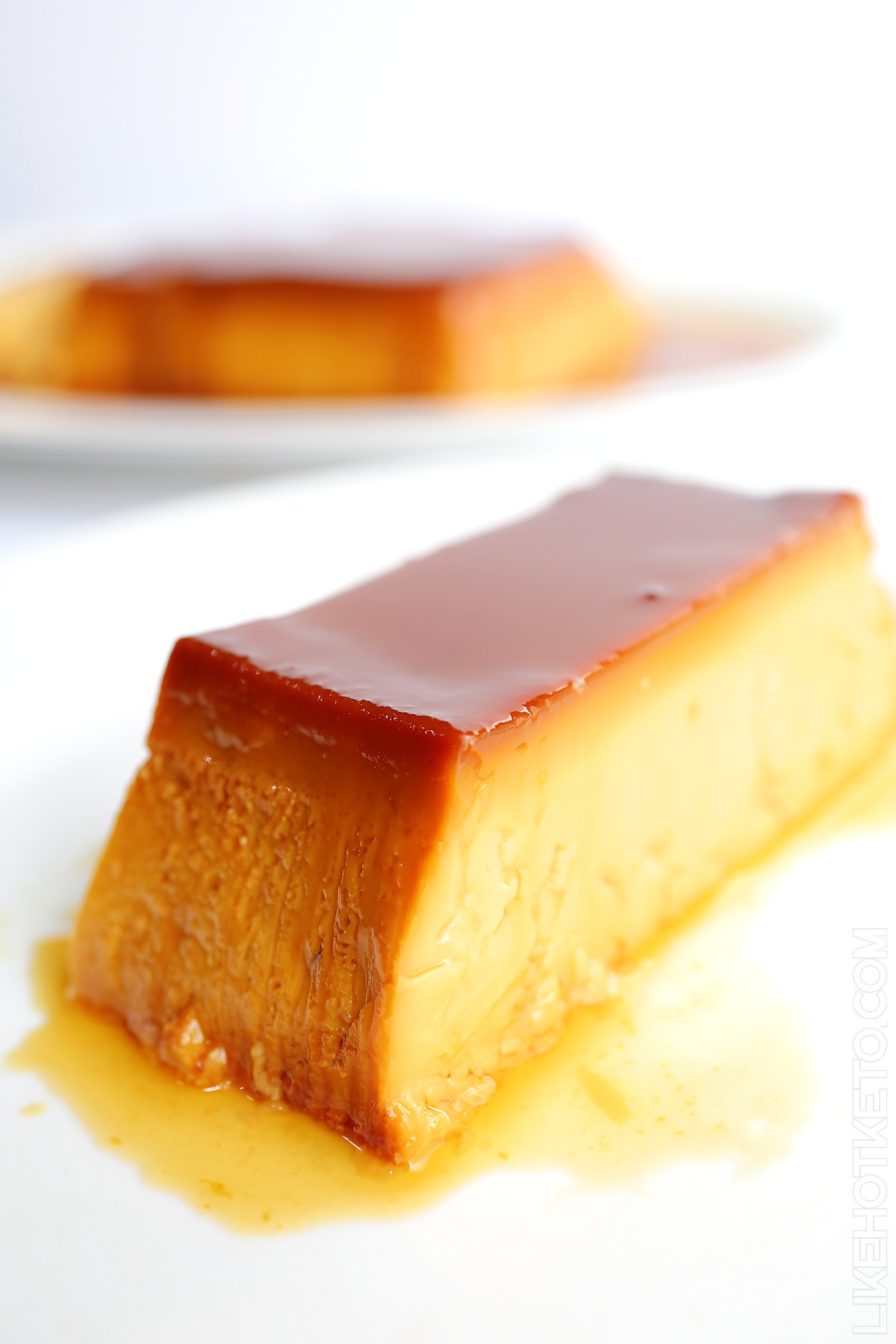 A golden slice of Abbot of Priscos keto flan, drizzled in caramel.