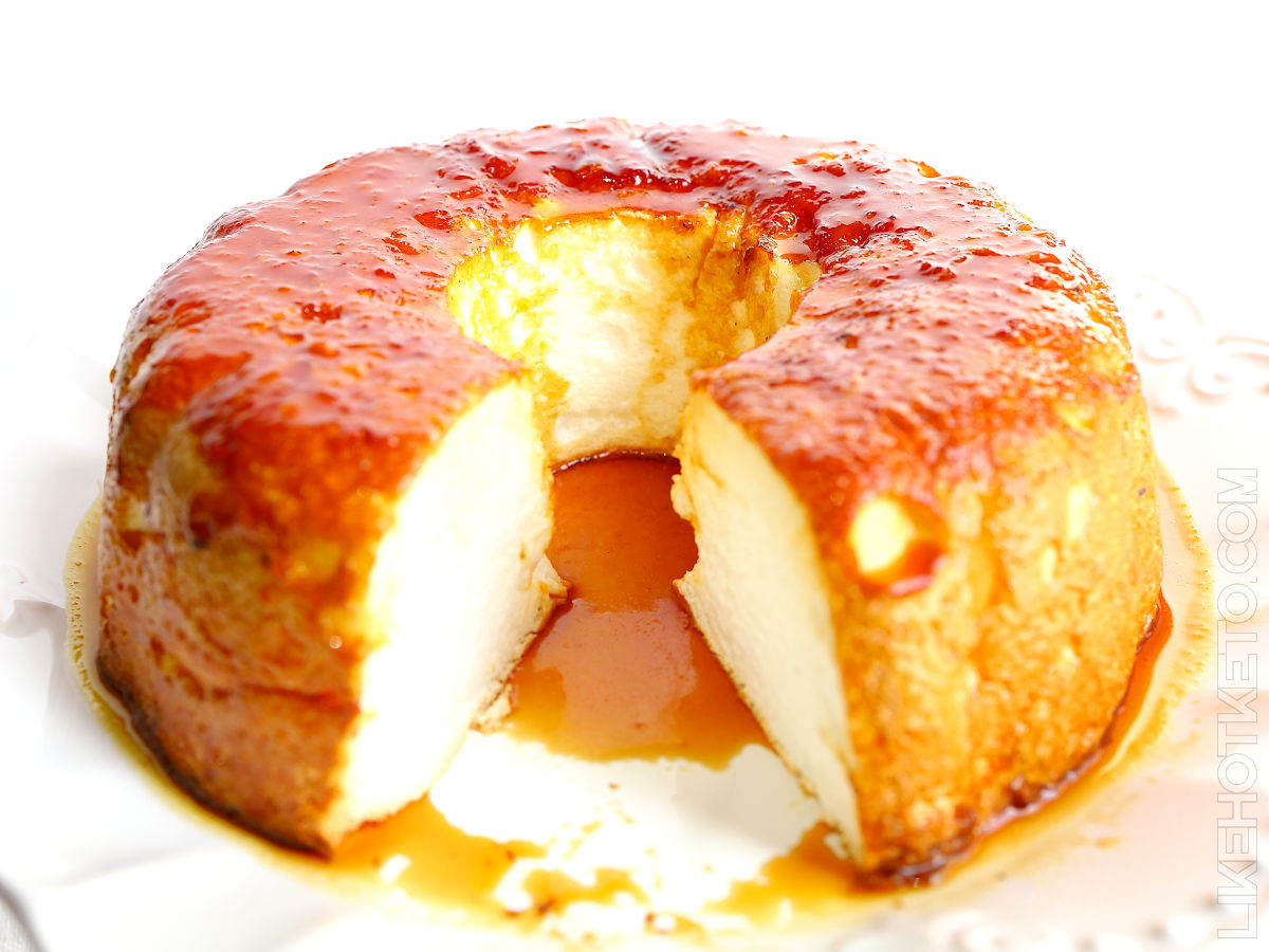Portuguese meringue pudding topped with sugar-free caramel on a cake platter.