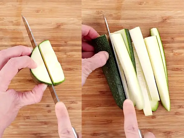 Zucchini being sliced lengthwise and in half-inch sticks.