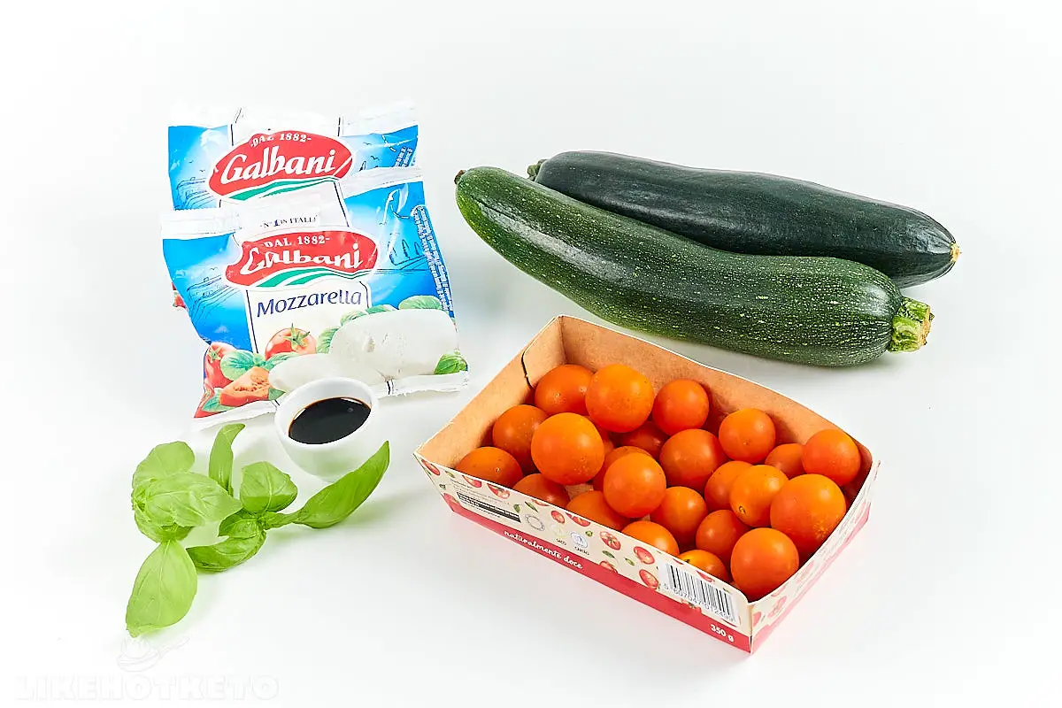 Gathered ingredients for zucchini tomato appetizers with mozzarella gratin recipe.