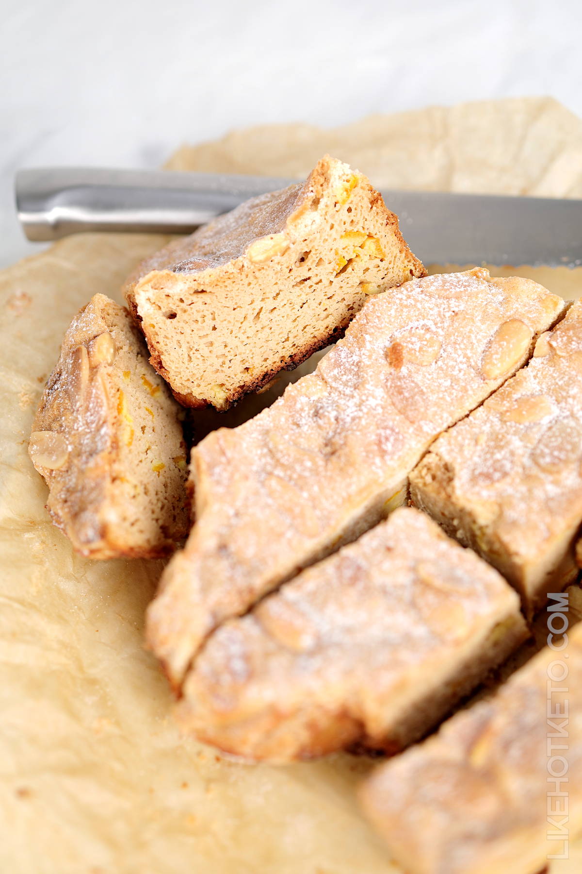 Sliced of Italian colomba with sugar-free candied orange peel pieces inside.