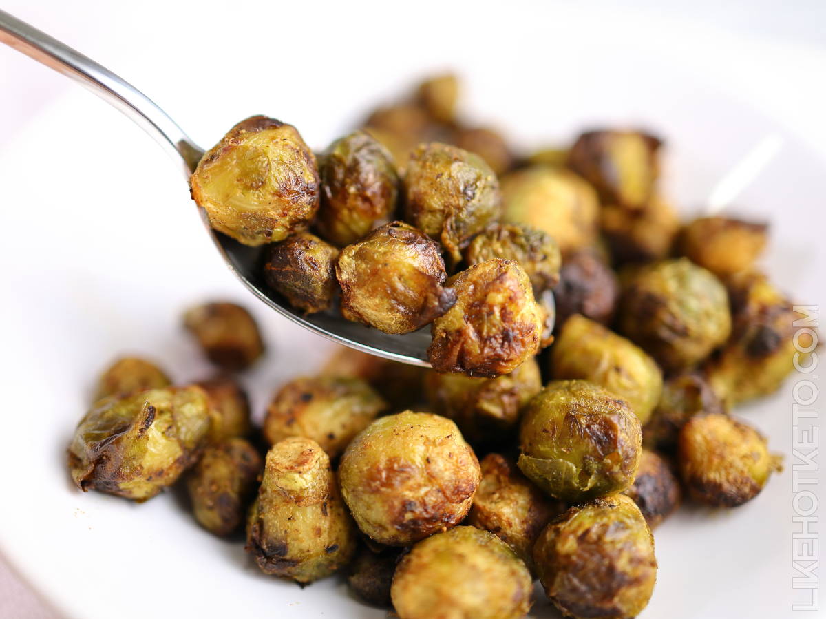 Spoonful of lightly browned and crispy Brussel sprouts.