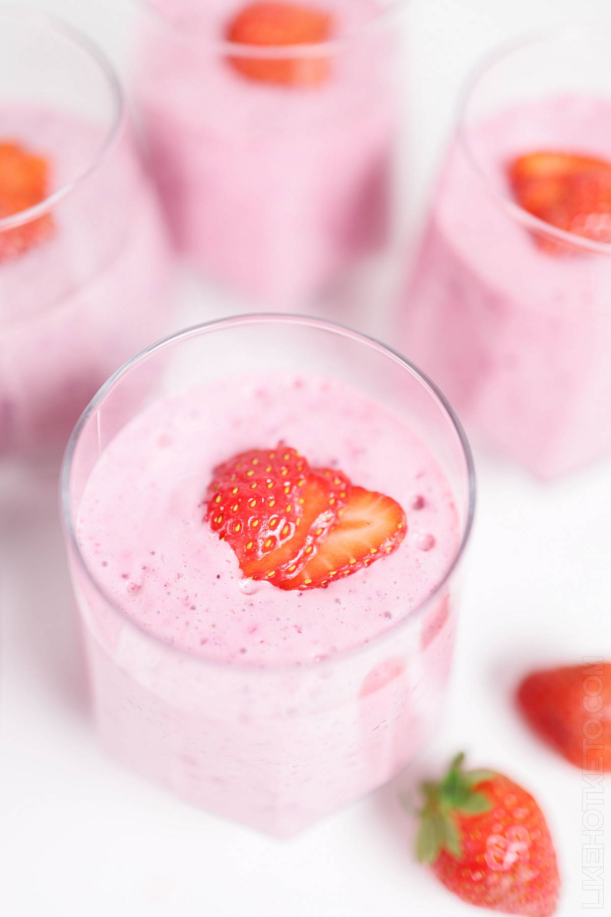 Sugar-free Greek yogurt and protein fluff topped with fresh strawberries.