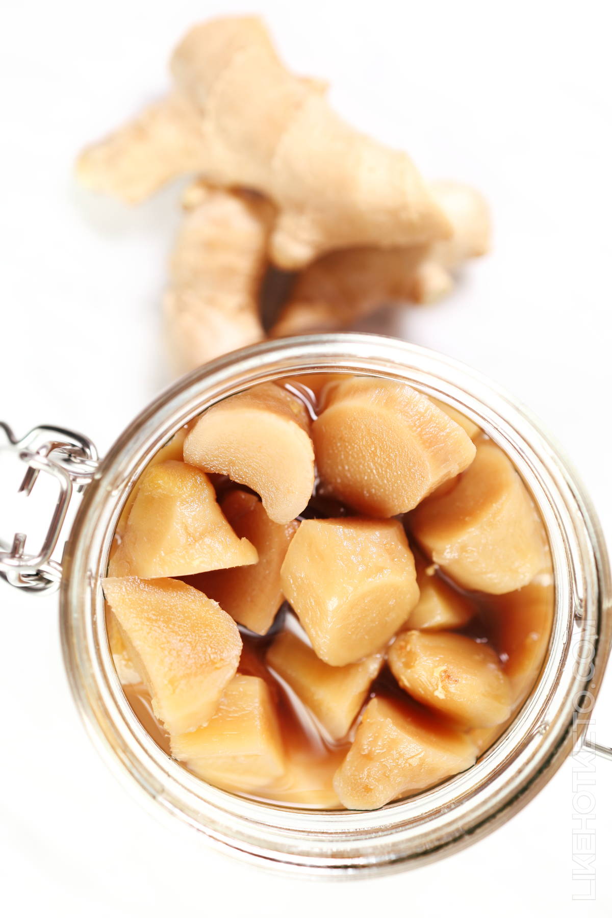 Mason jar with homemade preserved ginger without sugar.