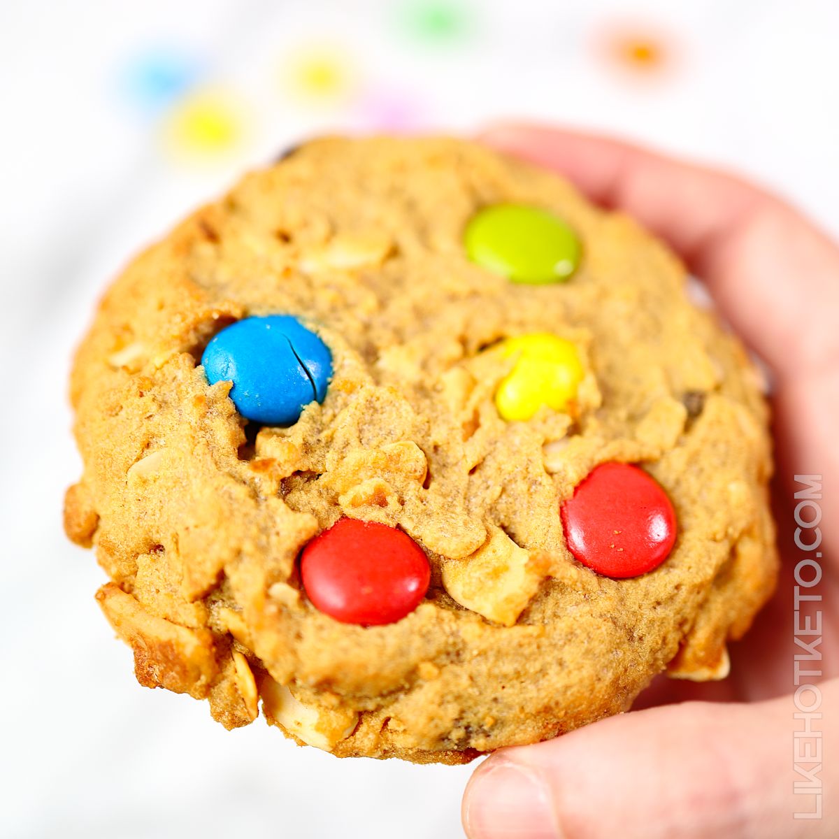 A large keto monster cookie with colorful m&m's.