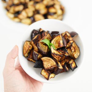 Serving of roasted eggplant pieces on a small plate.