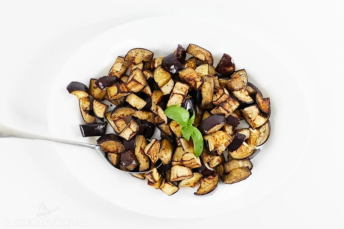 A dish with golden roasted eggplant cubes.