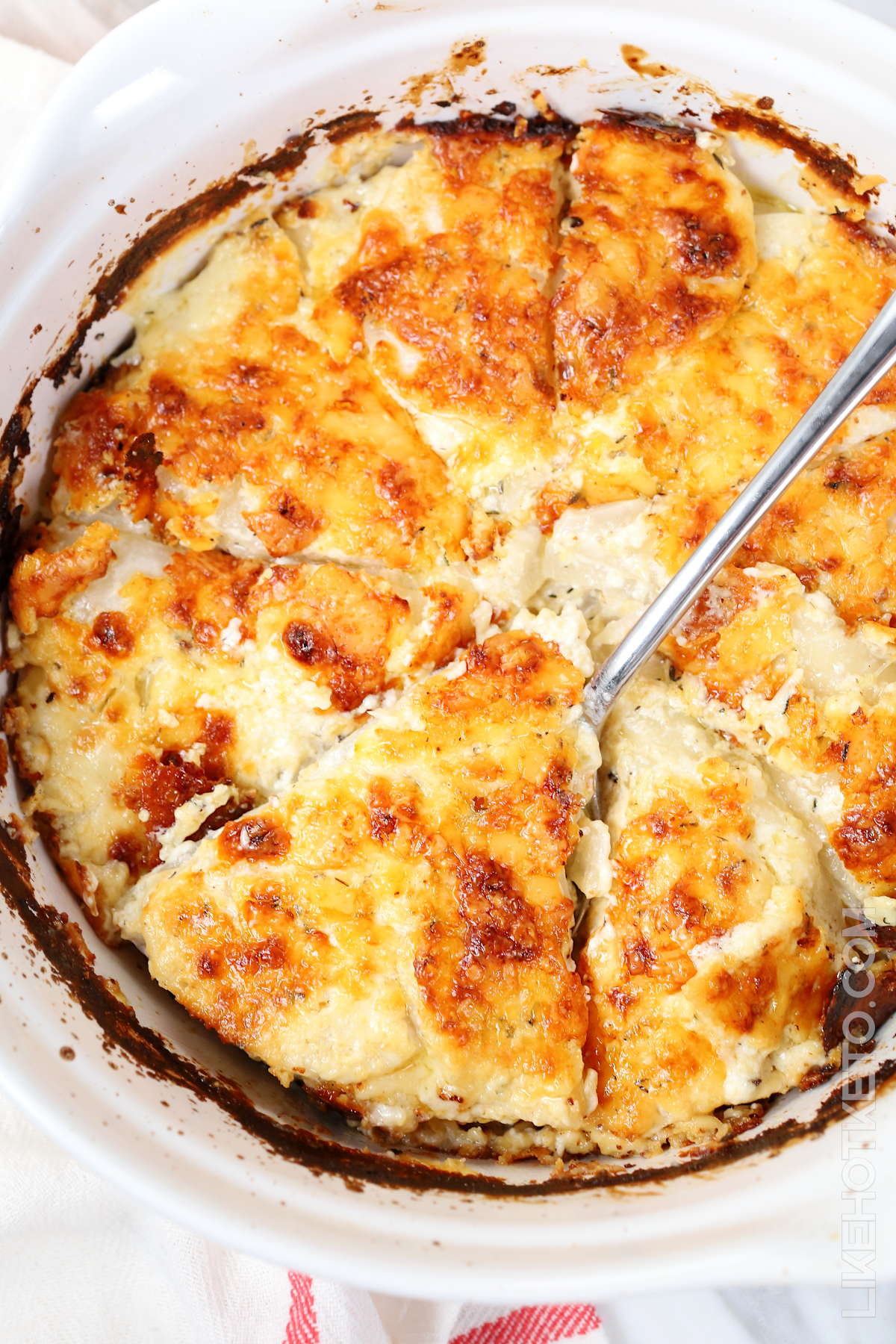 Scalloped turnips keto casserole with crusty cheese.