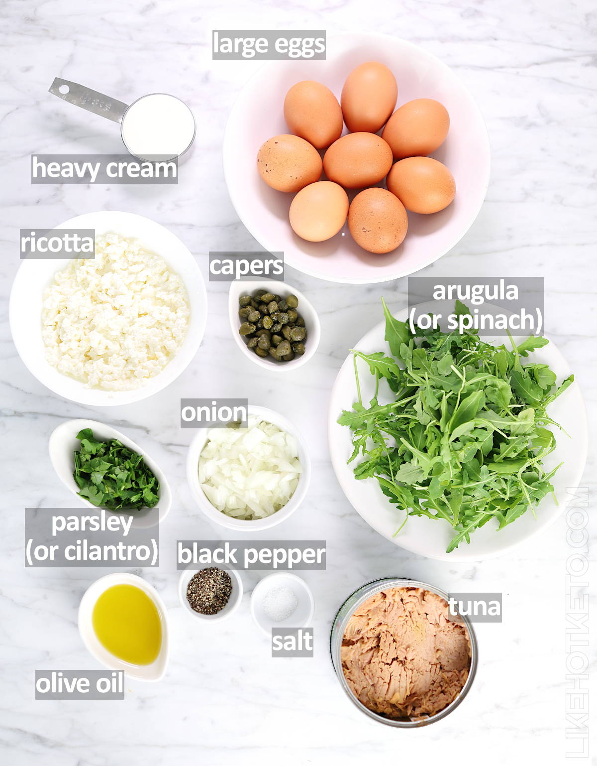 List of ingredients for the keto tuna frittata: eggs, heavy cream, ricotta, capers, arugula or spinach, onion, parsley or cilantro, salt, black pepper, olive oil and canned tuna.