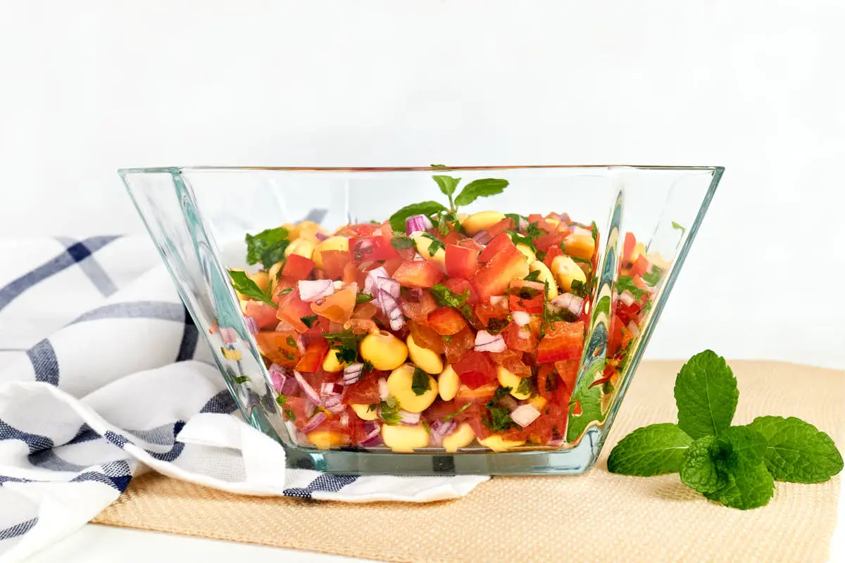 Glass bowl with colorful lupin bean salad.