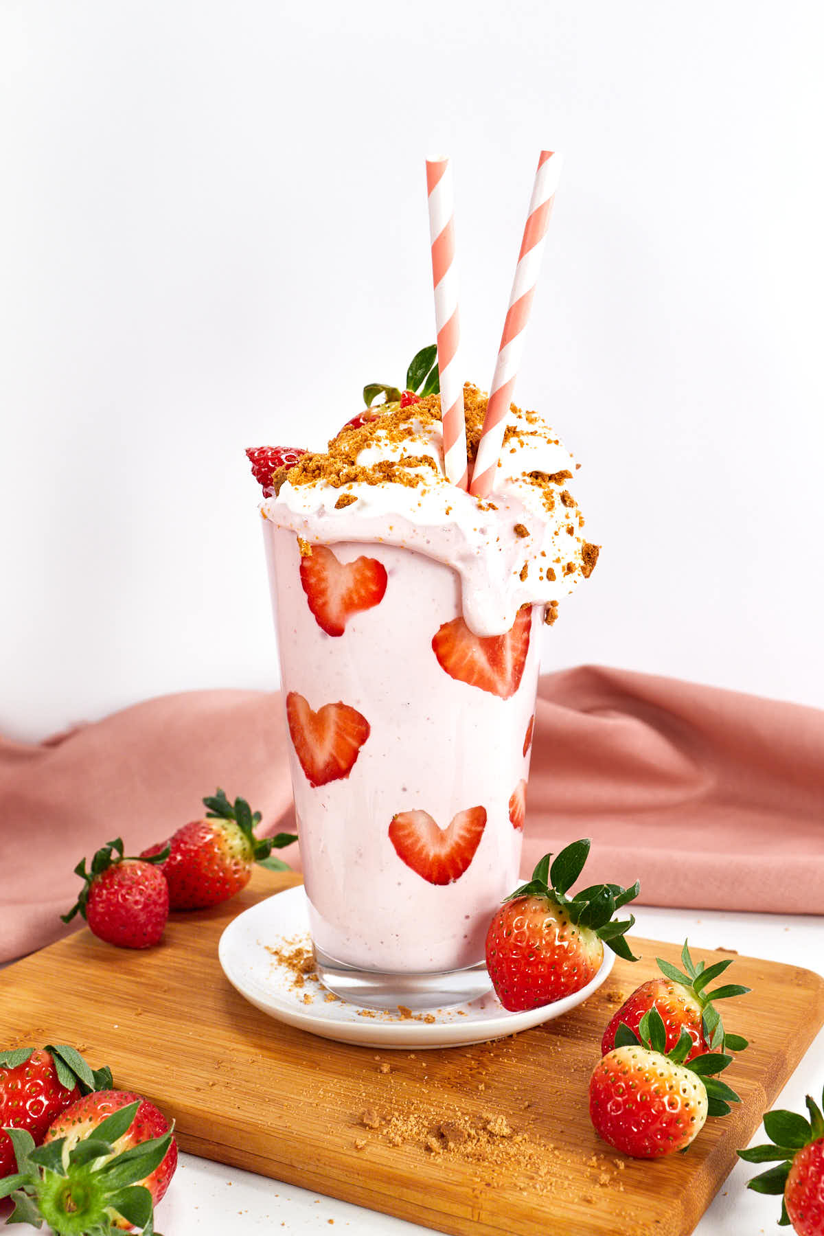 Strawberry cheesecake smoothie topped with whipped cream.
