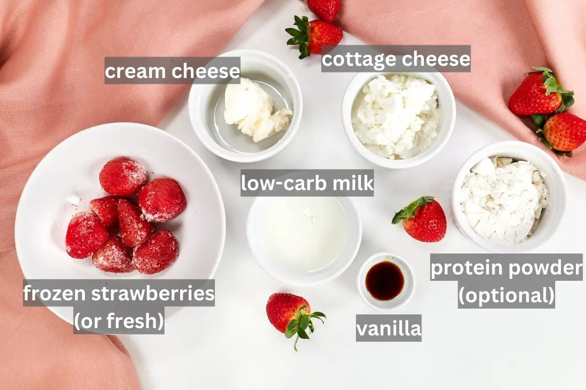 Gathered ingredients for keto strawberry cheesecake smoothie.
